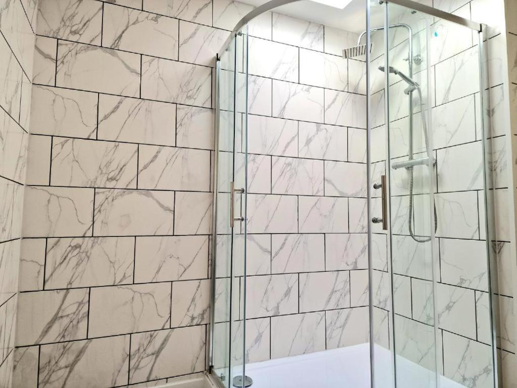 Walk-in marble shower room at The Granby Rooms