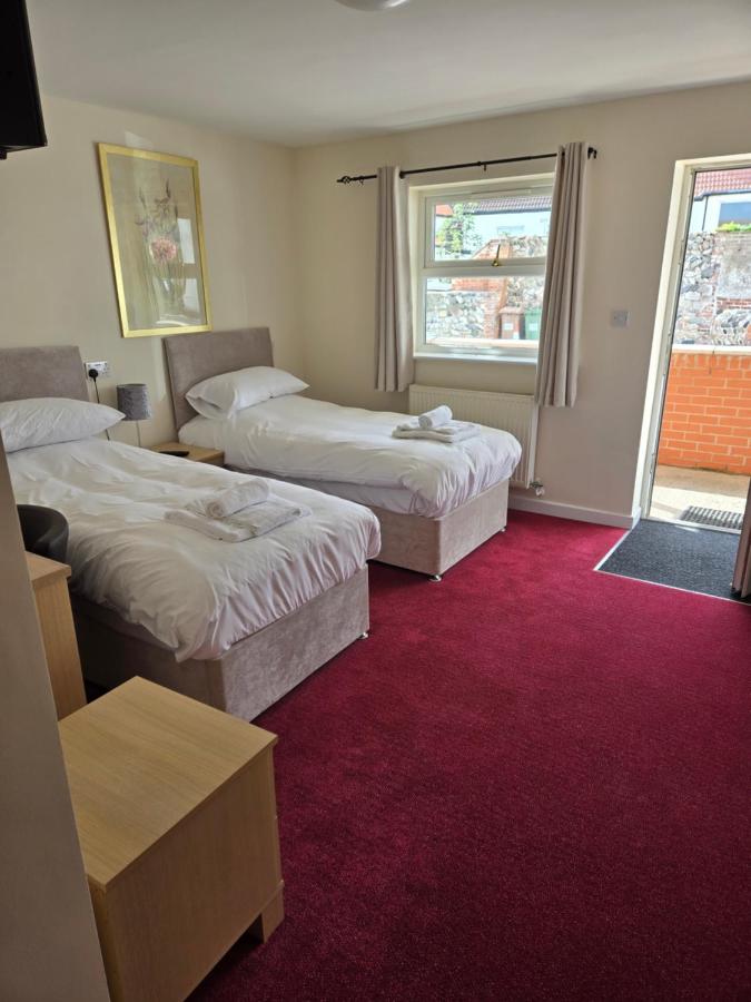 Twin bedroom with courtyard access at The Granby Rooms